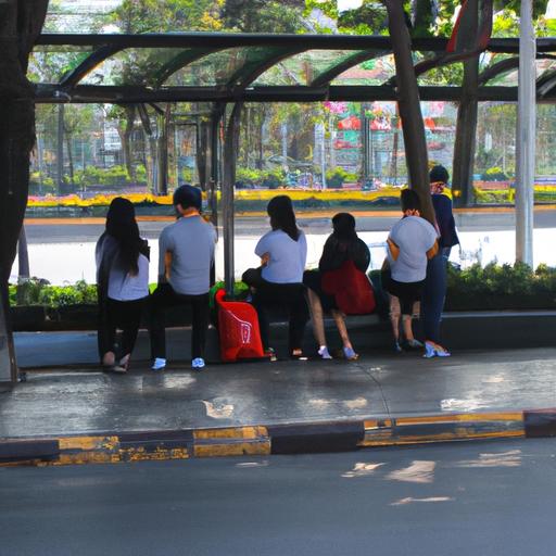 Hành khách đang đợi xe buýt tại trạm của 'Nhà Xe 9 Hùng Ba Tri'.