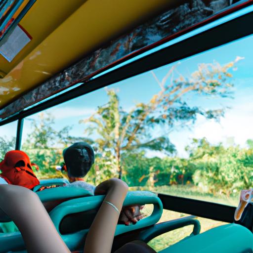 Nhóm du khách ngắm cảnh đẹp qua cửa sổ chiếc xe Nhà Xe Phú Quốc trên đường đến một điểm đến nổi tiếng.